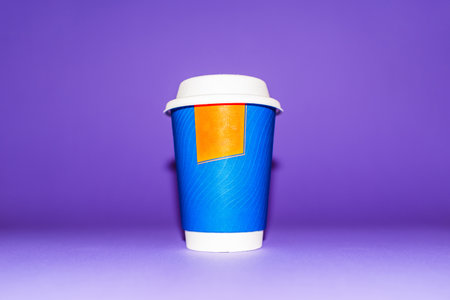 Beautiful Tea Coffee Juice Disposable Paper Cup in purple,veri peri blurred Background.の写真素材