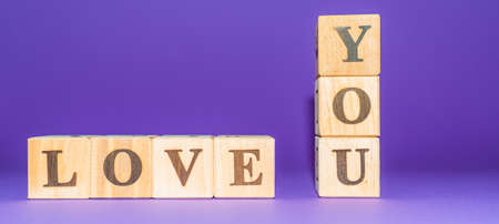 i love you text on wooden blocks purple veri peri background.copy space.Banner.の写真素材