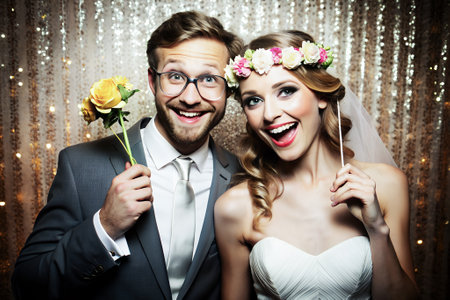 Bride and groom in photobooth. Wedding.の素材
