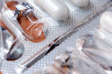 A plate of Health Supplement Capsules, Pills. Treatment for colds and flu. Selective focus.