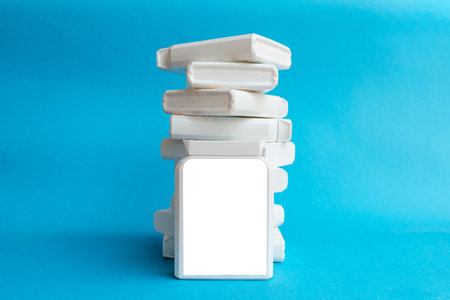 White blank mockup for ad. Pharmaceutical stacked up supplement plastic boxes on blue background.の写真素材