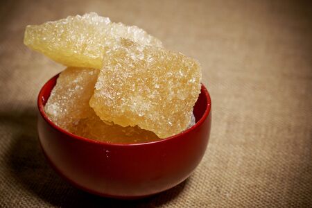 Bowl of brown rock sugarの写真素材