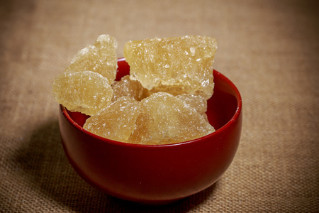 Bowl of brown rock sugarの写真素材