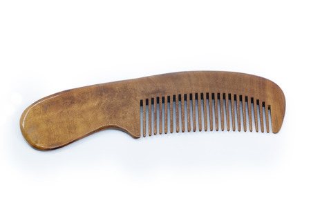 Wooden comb isolated on a white background