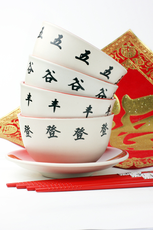 Chop sticks and a red bowlの写真素材