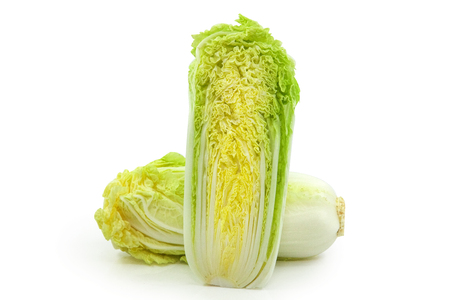 Two savoy cabbages isolated over white backgroundの写真素材