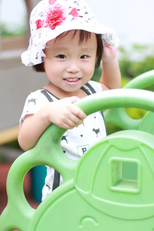 cute little girl in playgroundの写真素材