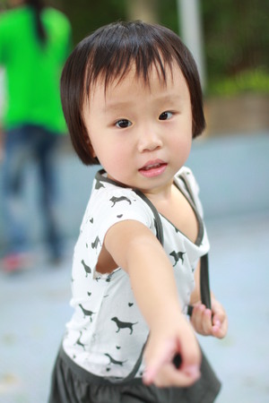 cute little girl in playgroundの写真素材