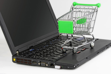 Mini shopping cart and computerの写真素材