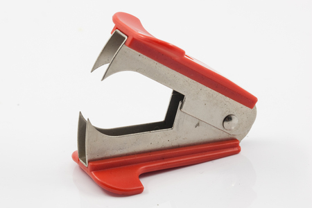 red staple remover isolated on white backgroundの写真素材