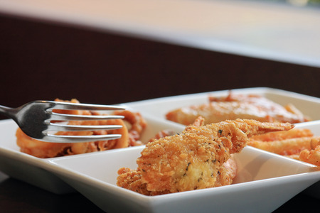 Savory party snack selection in a white porcelain disの写真素材