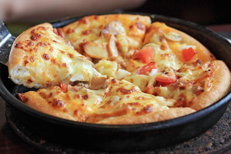 Pizza lifted slice の写真素材
