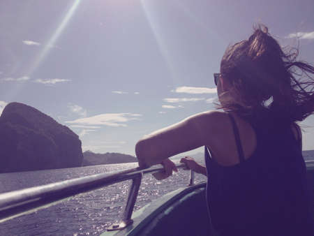 Asian Teenage Girl on the boat in the seaの素材