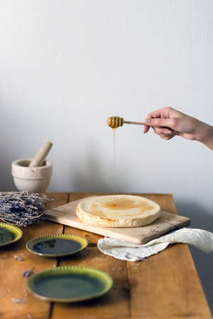 Rustic food still life: cottage cheese cake with honeyの写真素材