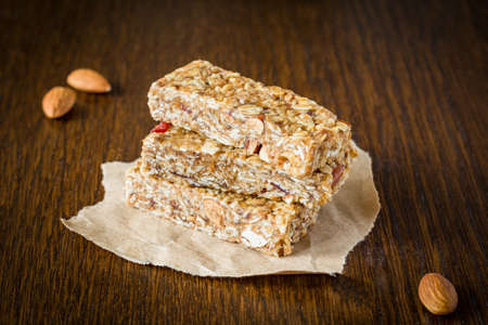 Granola bars or energy bars with nuts, oats and dried fruitsの写真素材