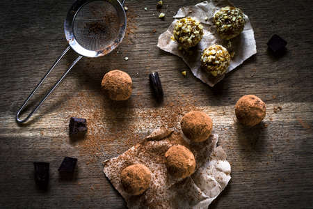 Homemade chocolate truffles on wooden backgroundの写真素材