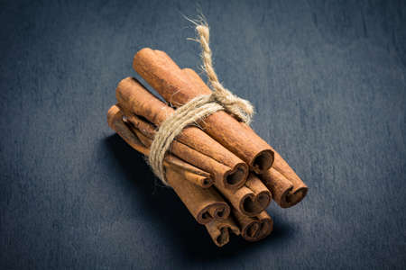 Cinnamon sticks on dark backgroundの写真素材