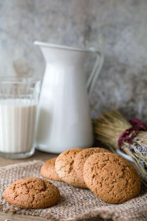 Chocolate chip oatmeal cookies and milk. Country still lifeの写真素材
