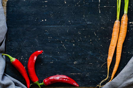 Old chopping board and fresh vegetables. Copy space for textの写真素材