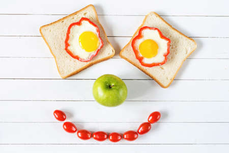 Happy food face - Food & Drink Smiling food face. Breakfast food concept, egg sandwich, apple and...