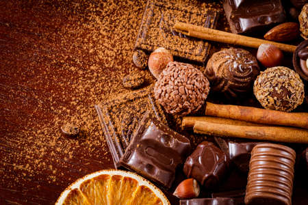 Assortment of chocolates, truffles, candies, chocolate barks, spices and nuts. Luxury chocolates....
