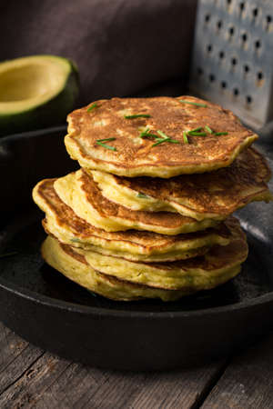 Vegetable pancakes in iron skillet closeup view