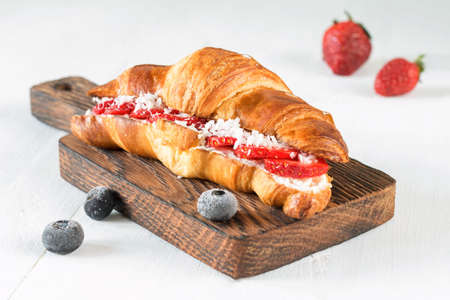 Sweet croissant with strawberriesの写真素材
