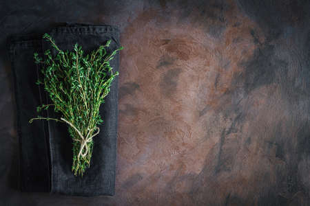 Thyme tied on a rusty background with copy space. Top view, flat layの写真素材