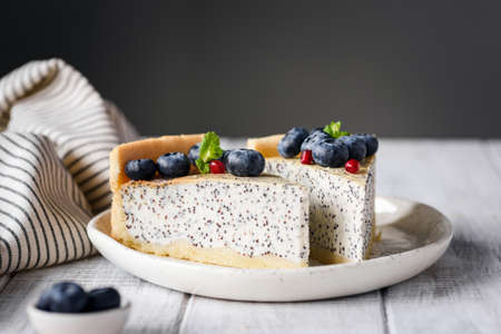 Two slices of cake on white plate. Selective focus