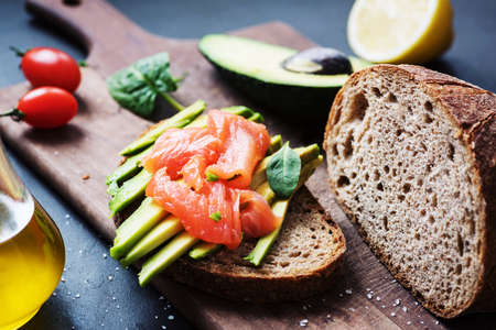 Rye toast with avocado and smoked salmon. Healthy snackの写真素材