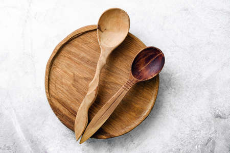 Wooden kitchen accessories or kitchen props on concrete background. Top view