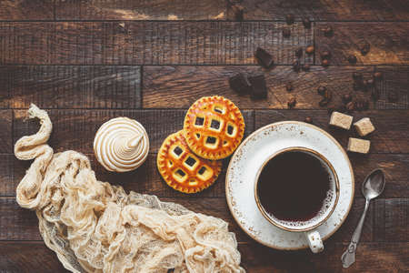 Coffee and cookies, food background. Table top view, toned imageの写真素材