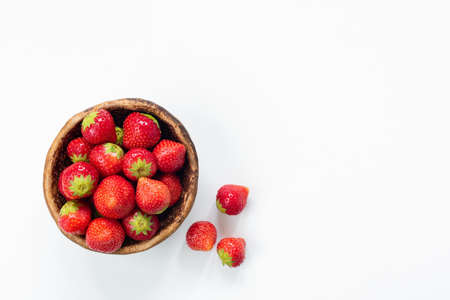 Strawberries in bowl on white background with copy space for text. Fresh tasty strawberries. Horizontalの写真素材