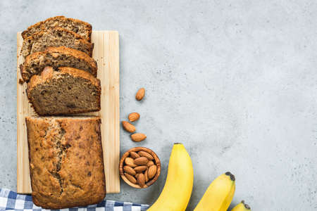 Healthy paleo banana bread loaf on grey concrete background. Table top viewの写真素材