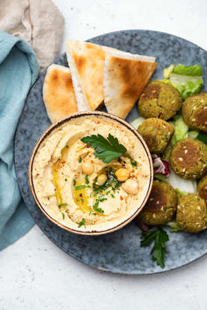Arabic cuisine food chickpea hummus, falafel and pita bread. Table top view.の写真素材