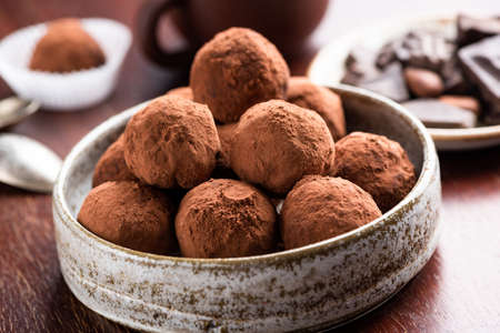 Vegetarian Chocolate Truffles With Raw Cocoa And Dates. Closeup View Of Pile Of Homemade Chocolate...