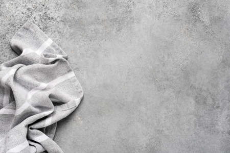 Linen kitchen napkin on grey concreteの写真素材