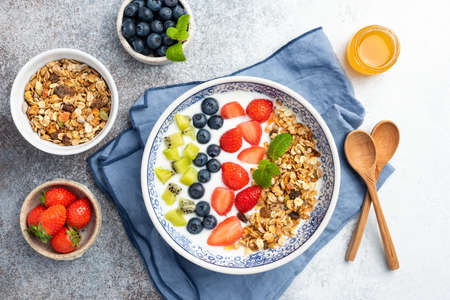 Healthy Breakfast Yogurt Bowl With Fruits. Flat Lay Composition, Table Top View. Vegetarian Clean Eating Conceptの写真素材