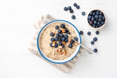 Oatmeal Porridge With Blueberries, Almonds In Bowlの写真素材