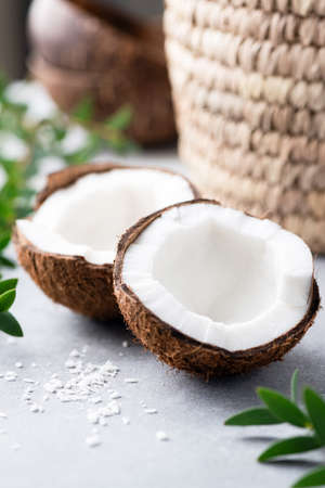Beautiful halved coconut. Spa clean eating and tropical summer freshness concept.の写真素材