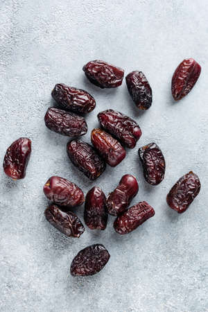 Tasty Dried Dates On Concrete Background Top Viewの写真素材