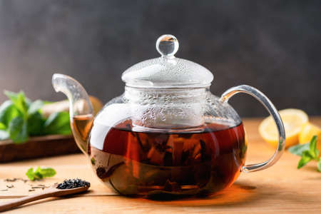 Black tea brewed in glass tea pot. Chinese black tea. Copy spaceの写真素材