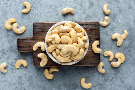 Cashew nuts in bowl top view. Healthy raw nuts of cashew fruitの写真素材