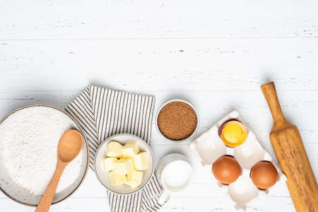 Baking cake or pastry or cookies ingredients on white wooden background. Top view ingredients for bakingの写真素材