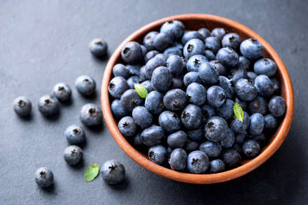 Organic blueberries in bowl. Tasty healthy juicy blueberriesの写真素材