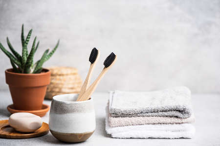 Charcoal toothbrush in bathroom. Eco sustainable lifestyle, health care, zero waste conceptの写真素材