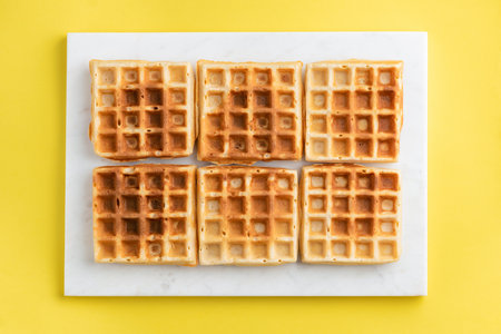 Belgian waffles on a white plateの写真素材