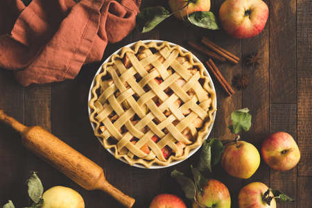 Classical american fall dessert Apple Pie on a rustic wooden table background, top viewの写真素材