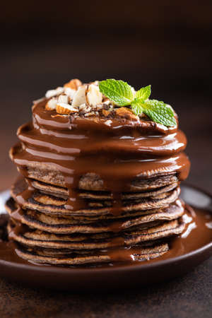 Empty ceramic plate on black background, top view. Food background with copy space for text or design elementsの写真素材