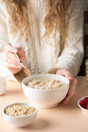 Fresh blueberries laid out in shape of heart on blue background, top viewの写真素材